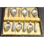 A set of silver golfing spoons, cased, Sheffield,