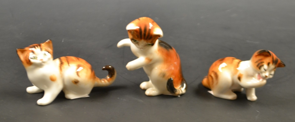 A set of three Royal Doulton  kittens (3)