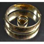 An 18ct gold signet ring, 5g; a 9ct gold hinged bangle,