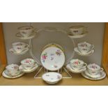 A New Chelsea tea service, decorated with blue bells and pink roses, comprising eight sided plates,