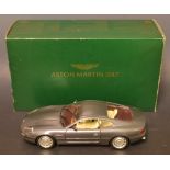 A Gultoy 1:18 scale moderl Aston Martin DB7 model car, square plinth base, boxed with literature.