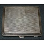 A silver rounded rectangular cigarette case, engine turned, vacant cartouch, Birmingham 1941,