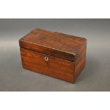 An early 19th century mahogany tea caddy,