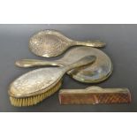 Silver - a George V three piece dressing table set, comprising hand mirror, clothes and hair brush,