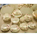 An Aynsley floral tea service comprising, two cake plates, eleven tea plates,