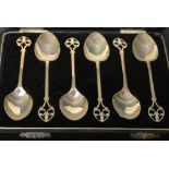 A set of six Art Deco silver teaspoons, pierced fleur de lys terminals, Birmingham 1932,