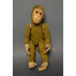 A German Schuco type Mohair and wire straw stuffed monkey