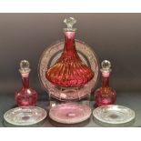 Glassware- a pair of 19th century cranberry flashed wheel etched oil bottles and stoppers;