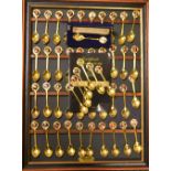 A set of forty commemorative 22 ct gold plated tea spoons, limited edition 1135/9500,