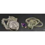 A silver souvenir Spanish Armada pendant and chain; a Mayan type pendant;