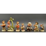 A Goebel pottery figure Merry Wanderer, others accordion boy,  Little Helper,