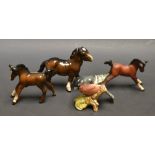 A Beswick Foal, matt brown;  another gloss;  a Royal Doulton Shire foal;  Beswick Bullfinch,