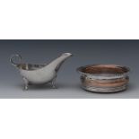 A George VI silver sauce boat, of George III design, loop handle, shaped pad feet, 18cm long,