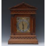 A late Victorian/Edwardian oak architectural bracket clock,  14cm  silvered chapter ring,