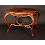 A late 19th century mahogany shaded serpentine centre table,
