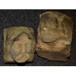 A pair of Gothic sandstone corbels, carved male and female masks,