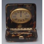 An Art Deco tortoiseshell rounded rectangular folding travelling time piece,