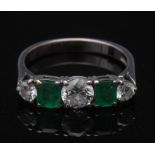 A diamond and emerald five stone hoop ring,