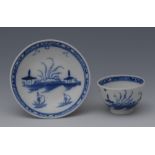 A Caughley toy tea bowl and saucer, decorated in underglaze blue with huts and boats, banded border,