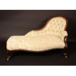 A Victorian walnut spoon back day bed, acanthus scroll cresting,