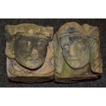 A pair of Gothic sandstone corbels, carved male and female masks,