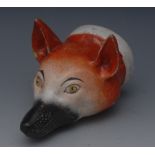 An English pottery novelty stirrup cup, as a fox mask, naturalistically modelled and painted, c.