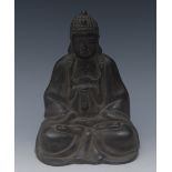 Chinese School, a dark patinated bronze, of Buddha, seated in meditation,