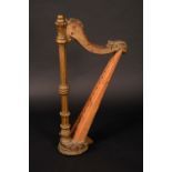 A 19th century giltwood harp, serpentine cresting carved with scrolling acanthus,