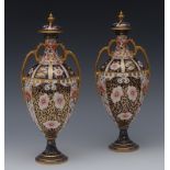 A pair of Royal Crown Derby 6299 pattern pedestal ovoid two-handled vases and covers,
