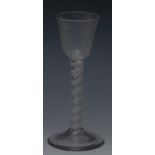 An 18th century wine glass, rounded funnel shaped bowl, engraved with potted vine and moth,