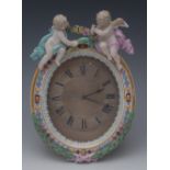 A Meissen oval easel mantel clock, the engine turned dial with Roman numerals, inscribed Howell