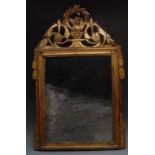 A George II/III giltwood looking glass, shaped cresting pierced and carved with a ho-ho bird,