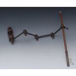 A George III mahogany adjustable articulated sewing clamp, turned ivory finials, 54cm long overall,