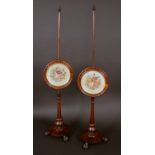 A pair of William IV rosewood pole screens, turned finials,