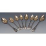A composed pair of George III silver berry spoons and six conforming dessert spoons,