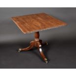 A Regency mahogany rounded rectangular tripod centre table, reeded top, turned column,