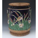 A George Jones type majolica garden seat, of barrel shape, the pierced top as faux woven rushes,