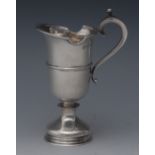 A George III style silver helmet cream jug, ring wasted body, shaped rim,