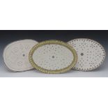 A Spode Creamware oval strainer, the border with stylised leaves in tones of grey, 37cm wide, c.