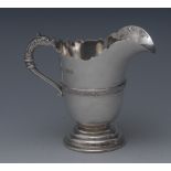 A George V silver helmet shaped cream jug,  central girdle with Celtic design, 9.