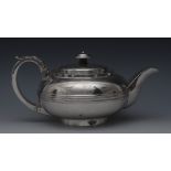 A George III Provincial silver compressed teapot, flush-hinged domed cover,