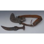 A Yemeni jambiya, 17cm curved blade, wooden grip, silver coloured metal mounts and scabbard,