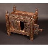 A Indian dowry chest, knop finials, three-quarter gallery, above a sliding compartment,
