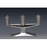 A German Modernist silver three-light table candelabrum, tapered quatrefoil sconces,