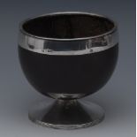 A George III silver mounted pedestal coconut cup, reeded borders, spreading base, 10.