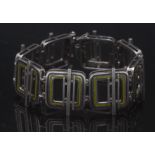 An Italian Uno A Erre modernist silver and enamelled bracelet, eight rounded square panels,