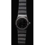 A lady's Omega Constellation My Choice Mini wristwatch, black dial, polished steel baton markers, 0.