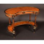 A 19th century French brass mounted ebony crossbanded satinwood kidney shaped writing table,