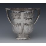 A large Arts and Crafts silver tyg, chased with a band of fruiting oak above stylised papyrus,