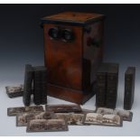 A Victorian walnut veneered twin eye piece table top stereoscopic card viewer , turned handles,